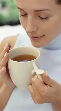 Woman Holding Cup of Tea