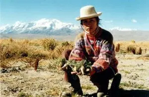 woman holding root vegetables