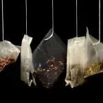 teabags against a black background