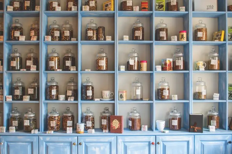 Apothecary shelf of jars of herbs